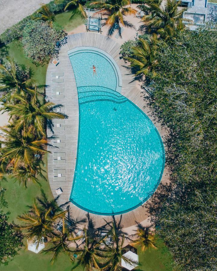 Lux* Grand Gaube Resort & Villas Экстерьер фото Aerial view of the pool at the 2019 World Championships